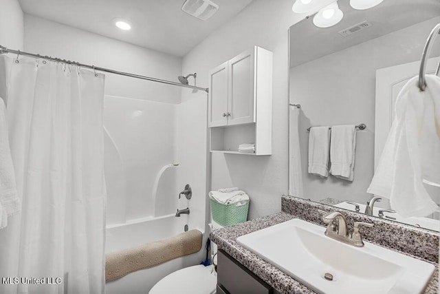 full bathroom featuring vanity, toilet, and shower / tub combo