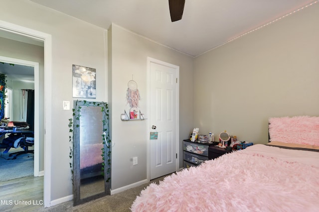 carpeted bedroom with ceiling fan