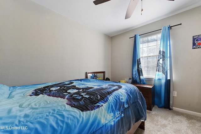 bedroom with ceiling fan and light carpet