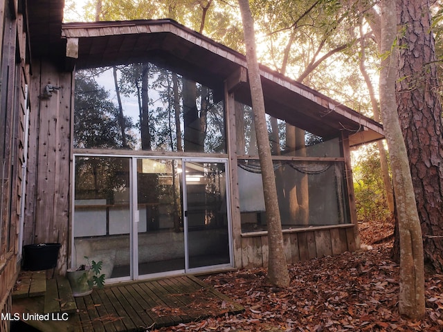 exterior space featuring a sunroom