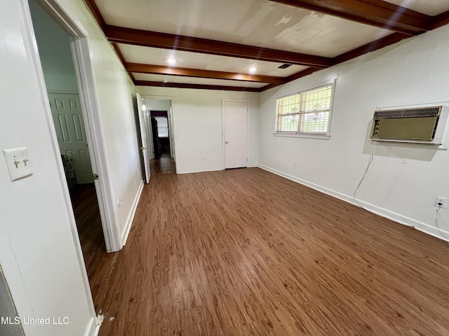 111 E Gresham St, Indianola, MS 38751 - unfurnished room featuring baseboards, a wall unit AC, and wood finished floors