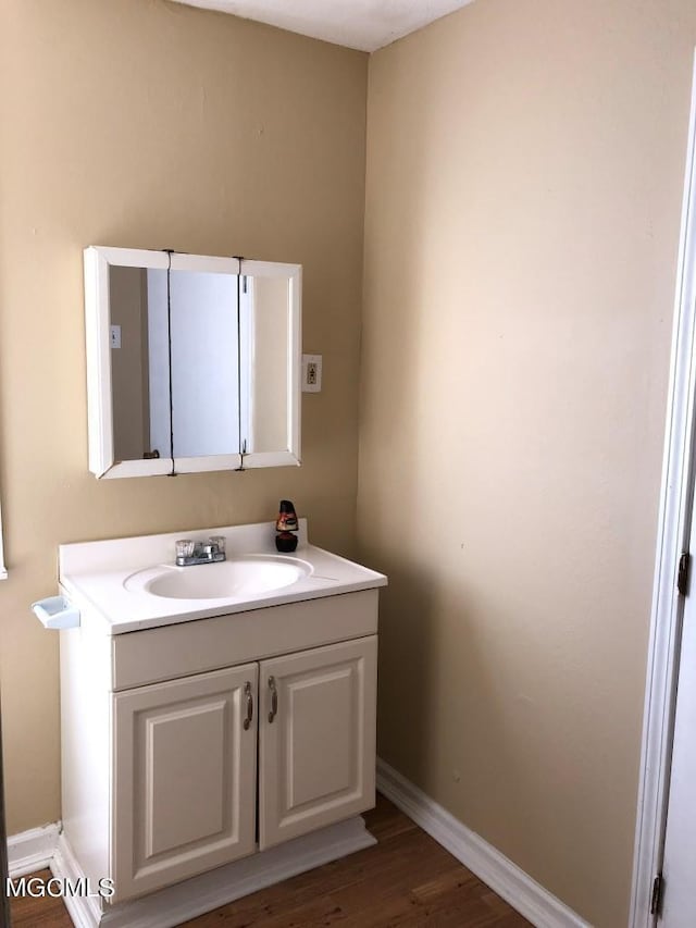 bathroom featuring vanity and hardwood / wood-style floors