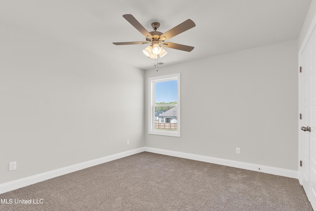 10243 March Meadows Way, Olive Branch, MS 38654 - spare room featuring dark carpet, a ceiling fan, and baseboards