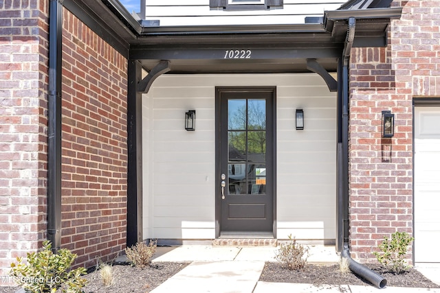 10243 March Meadows Way, Olive Branch, MS 38654 - view of exterior entry featuring brick siding