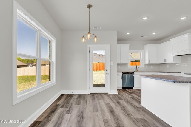 10243 March Meadows Way, Olive Branch, MS 38654 - kitchen featuring dishwasher, tasteful backsplash, white cabinetry, a sink, and wood finished floors