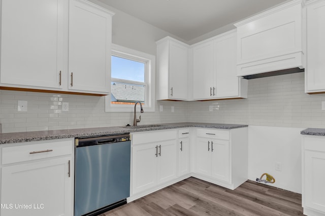 10243 March Meadows Way, Olive Branch, MS 38654 - kitchen featuring dishwasher, a sink, light stone counters, light wood finished floors, and white cabinetry