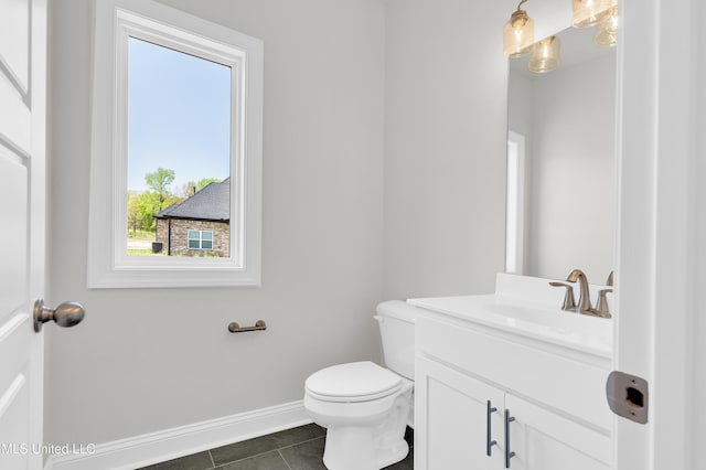 10243 March Meadows Way, Olive Branch, MS 38654 - half bathroom featuring vanity, toilet, baseboards, and tile patterned flooring