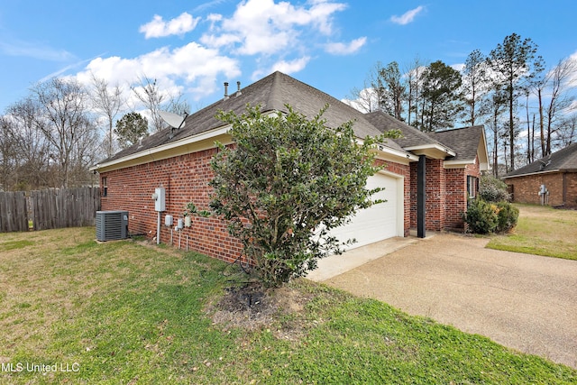 view of side of property with a yard, brick siding, and an attached garage