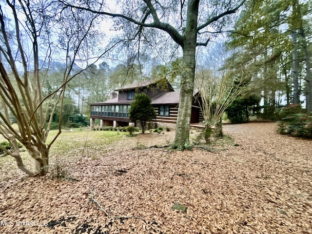 view of yard with a sunroom