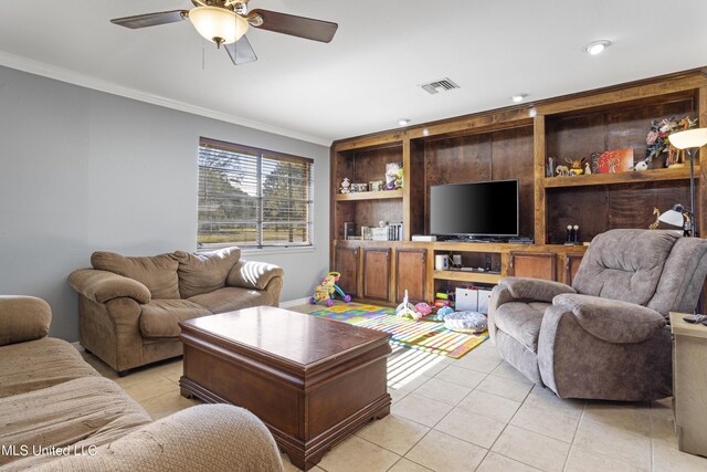 living room featuring ceiling fan, light tile patterned floors, and ornamental molding