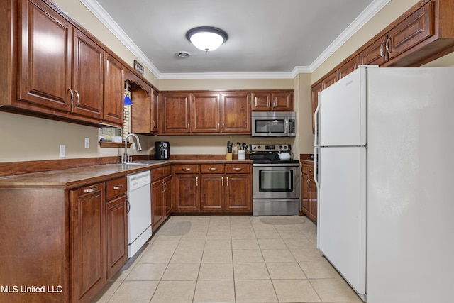 kitchen featuring light tile patterned flooring, ornamental molding, sink, and appliances with stainless steel finishes