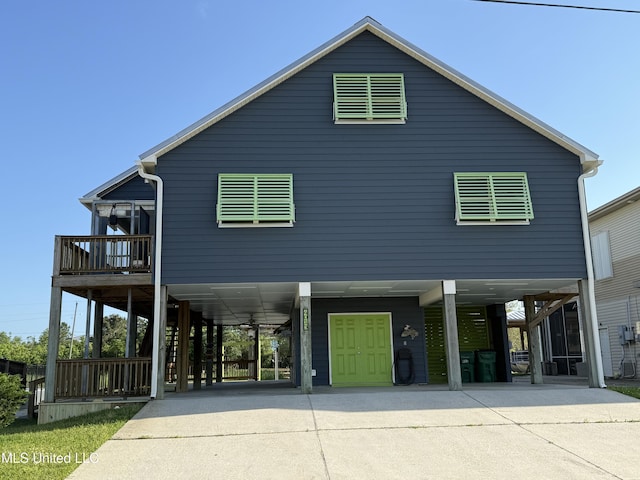 4013 Haiti St, Bay Saint Louis, MS 39520 - raised beach house with a carport and concrete driveway