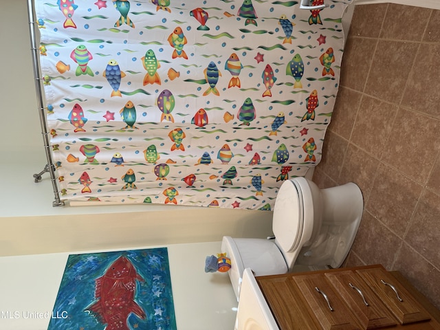 4013 Haiti St, Bay Saint Louis, MS 39520 - bathroom with tile walls and toilet
