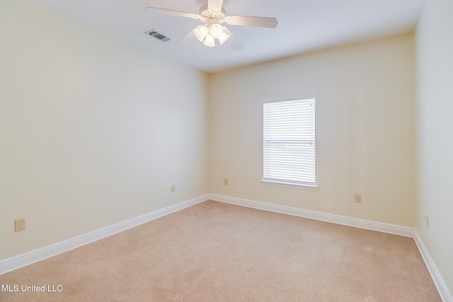 4013 Haiti St, Bay Saint Louis, MS 39520 - empty room featuring light colored carpet, baseboards, a ceiling fan, and visible vents