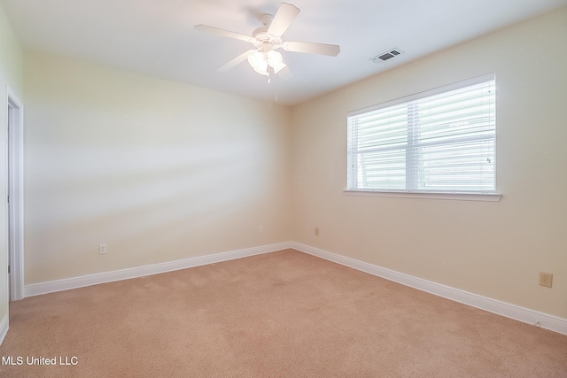 4013 Haiti St, Bay Saint Louis, MS 39520 - unfurnished room with visible vents, a ceiling fan, baseboards, and light carpet