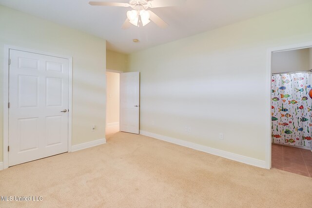4013 Haiti St, Bay Saint Louis, MS 39520 - unfurnished bedroom with carpet floors, baseboards, and ceiling fan