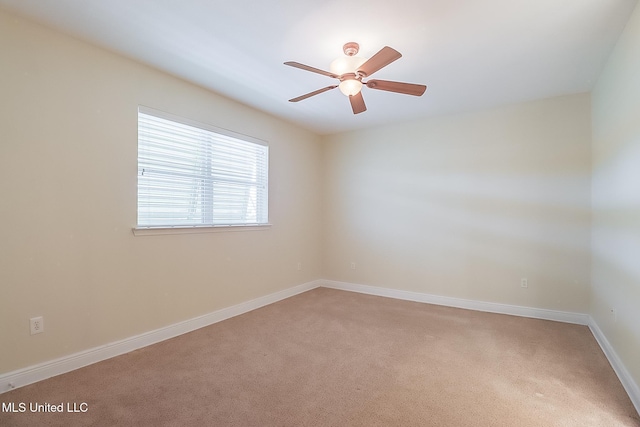 4013 Haiti St, Bay Saint Louis, MS 39520 - empty room with light colored carpet, baseboards, and a ceiling fan