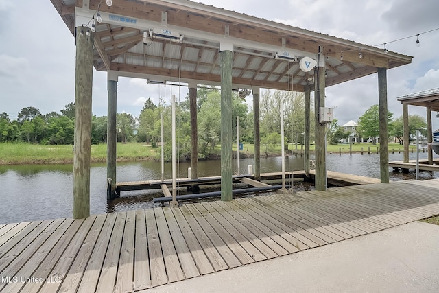 4013 Haiti St, Bay Saint Louis, MS 39520 - dock area featuring boat lift and a water view