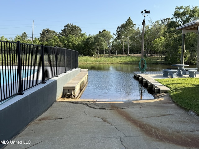 4013 Haiti St, Bay Saint Louis, MS 39520 - dock area featuring a water view and a swimming pool