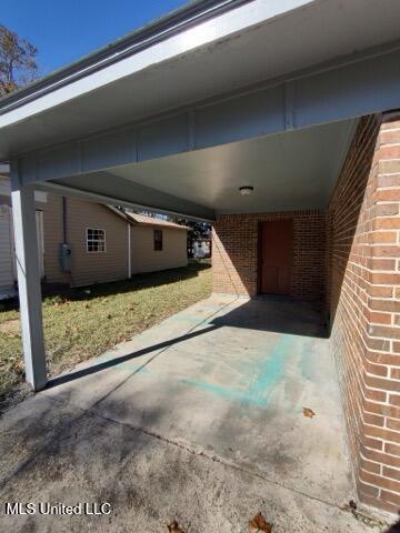 view of patio / terrace featuring a carport