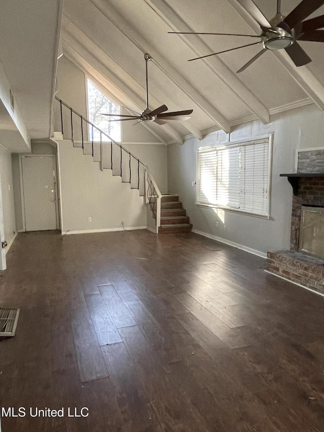 unfurnished living room featuring lofted ceiling with beams, ceiling fan, dark hardwood / wood-style flooring, and a fireplace