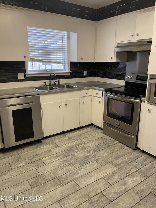 kitchen with white cabinetry, sink, and stainless steel appliances