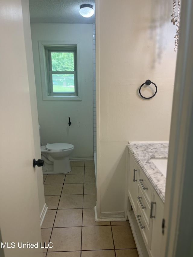 850 Friendship Rd, Ashland, MS 38603 - bathroom with vanity, toilet, tile patterned floors, and baseboards
