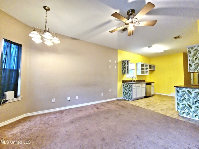5391 Quail Creek Cir, Diberville, MS 39540 - unfurnished living room with light colored carpet, a chandelier, and a ceiling fan