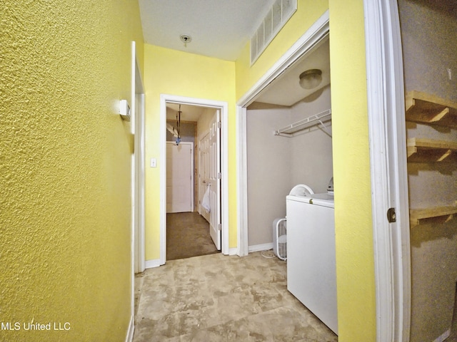 5391 Quail Creek Cir, Diberville, MS 39540 - laundry area with a textured wall and washer / dryer