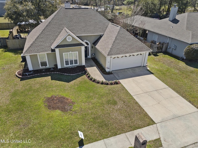 view of front of home featuring a garage, fence, driveway, roof with shingles, and a front lawn