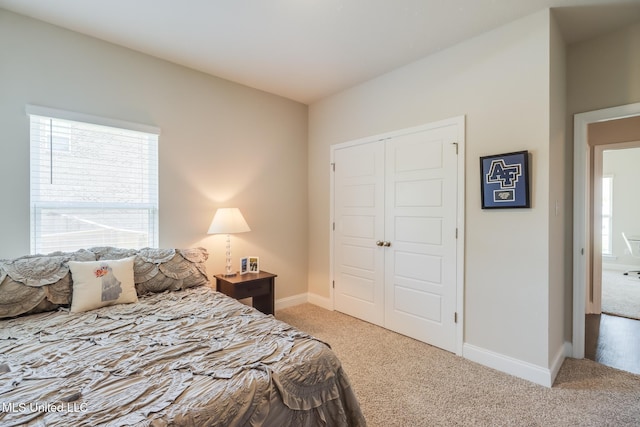 11625 Talla Dr, Ocean Springs, MS 39564 - bedroom with light carpet, multiple windows, and a closet