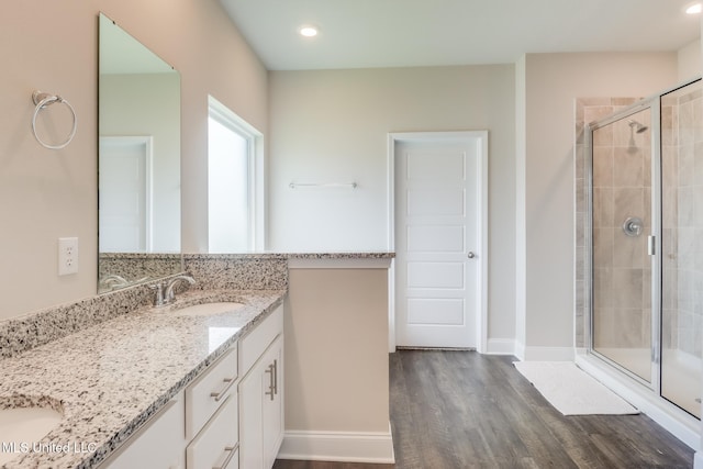 11625 Talla Dr, Ocean Springs, MS 39564 - full bath with double vanity, a stall shower, wood finished floors, and recessed lighting