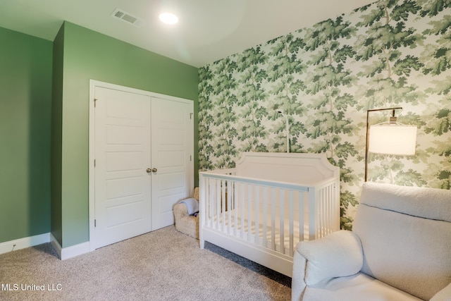 11625 Talla Dr, Ocean Springs, MS 39564 - bedroom with a closet, wallpapered walls, carpet, and a nursery area