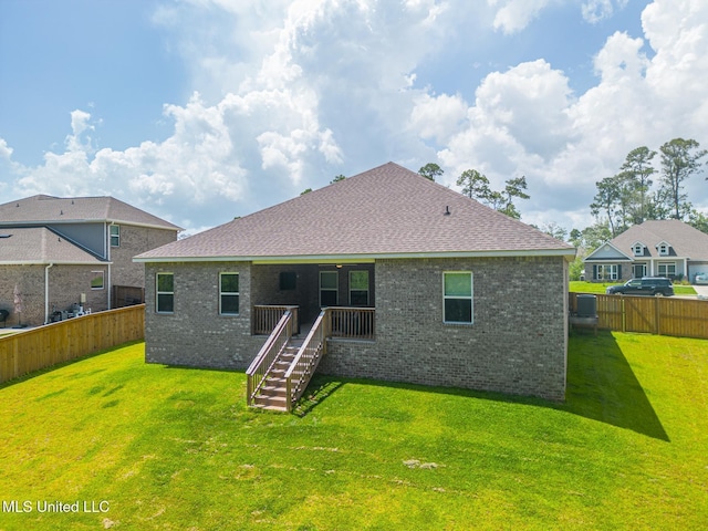 11625 Talla Dr, Ocean Springs, MS 39564 - back of property featuring a fenced backyard, brick siding, stairway, and a shingled roof