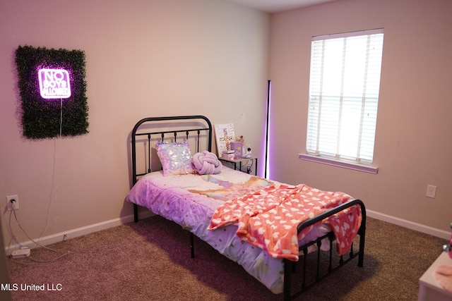 bedroom with carpet and baseboards