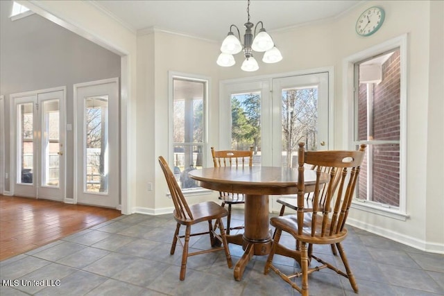 dining space featuring an inviting chandelier and ornamental molding