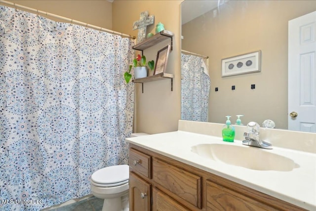 bathroom with vanity and toilet