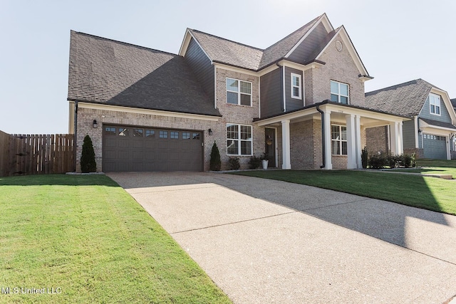 view of front of house with driveway, brick siding, a front yard, and fence