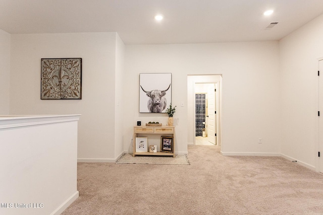 corridor featuring baseboards, carpet, and recessed lighting