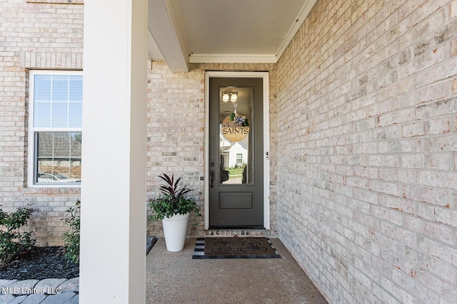 property entrance with brick siding