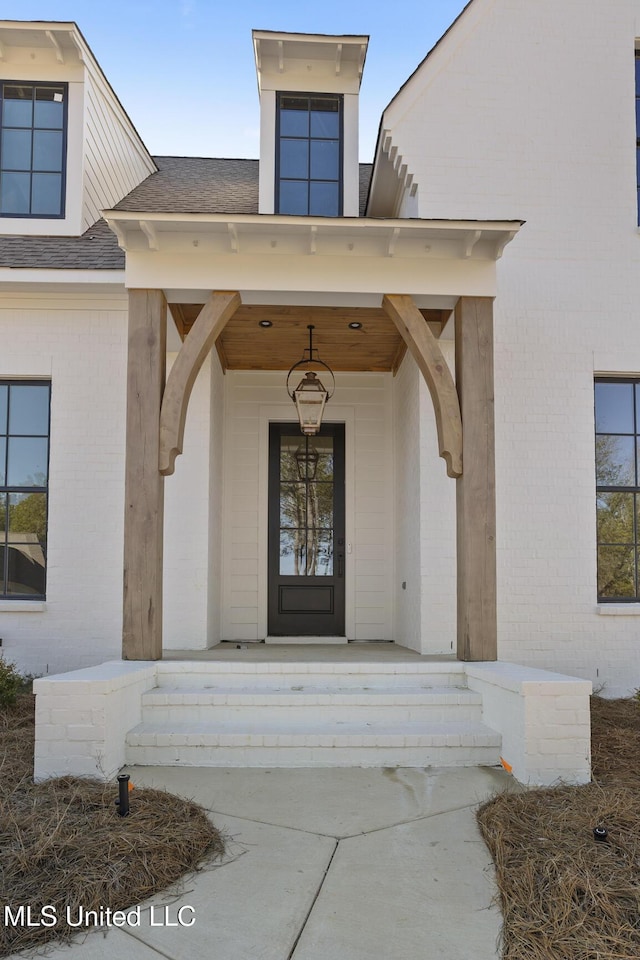 doorway to property featuring a porch