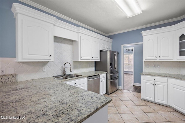 kitchen featuring light stone counters, white cabinets, and appliances with stainless steel finishes