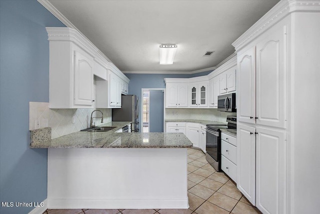 kitchen featuring kitchen peninsula, white cabinets, and stainless steel appliances