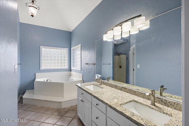 bathroom with tile patterned flooring, vanity, and plus walk in shower