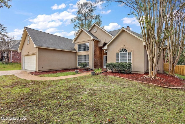 view of front property featuring a front lawn and a garage