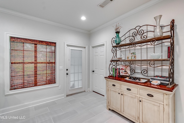 708 Oak Trl, Canton, MS 39046 - doorway to outside featuring crown molding, baseboards, and light tile patterned flooring
