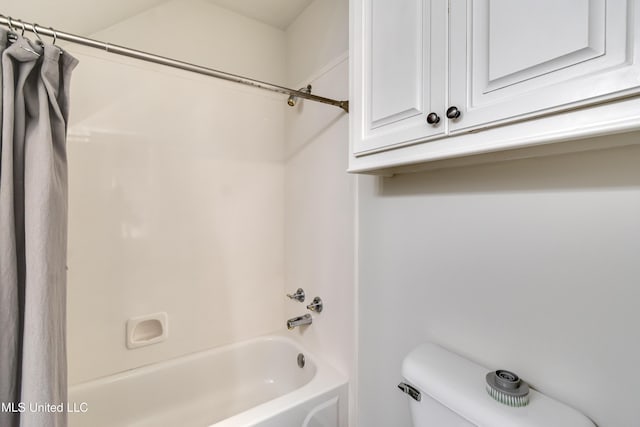 708 Oak Trl, Canton, MS 39046 - bathroom with shower / tub combo with curtain and toilet