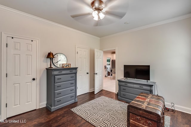 708 Oak Trl, Canton, MS 39046 - bedroom featuring ornamental molding, baseboards, dark wood finished floors, and a ceiling fan