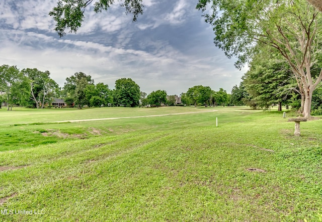 708 Oak Trl, Canton, MS 39046 - view of grassy yard with view of wooded area and view of golf course