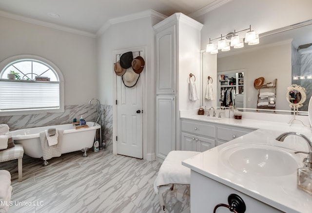 708 Oak Trl, Canton, MS 39046 - full bathroom featuring a closet, ornamental molding, a freestanding bath, marble finish floors, and double vanity